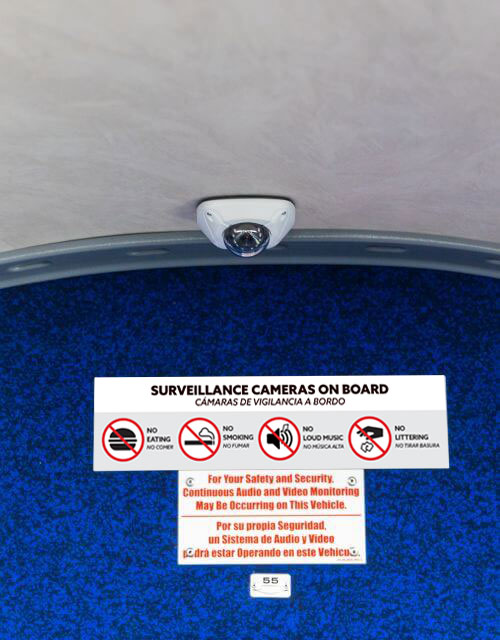 Security camera and signage inside METRO Park & Ride commuter express bus.